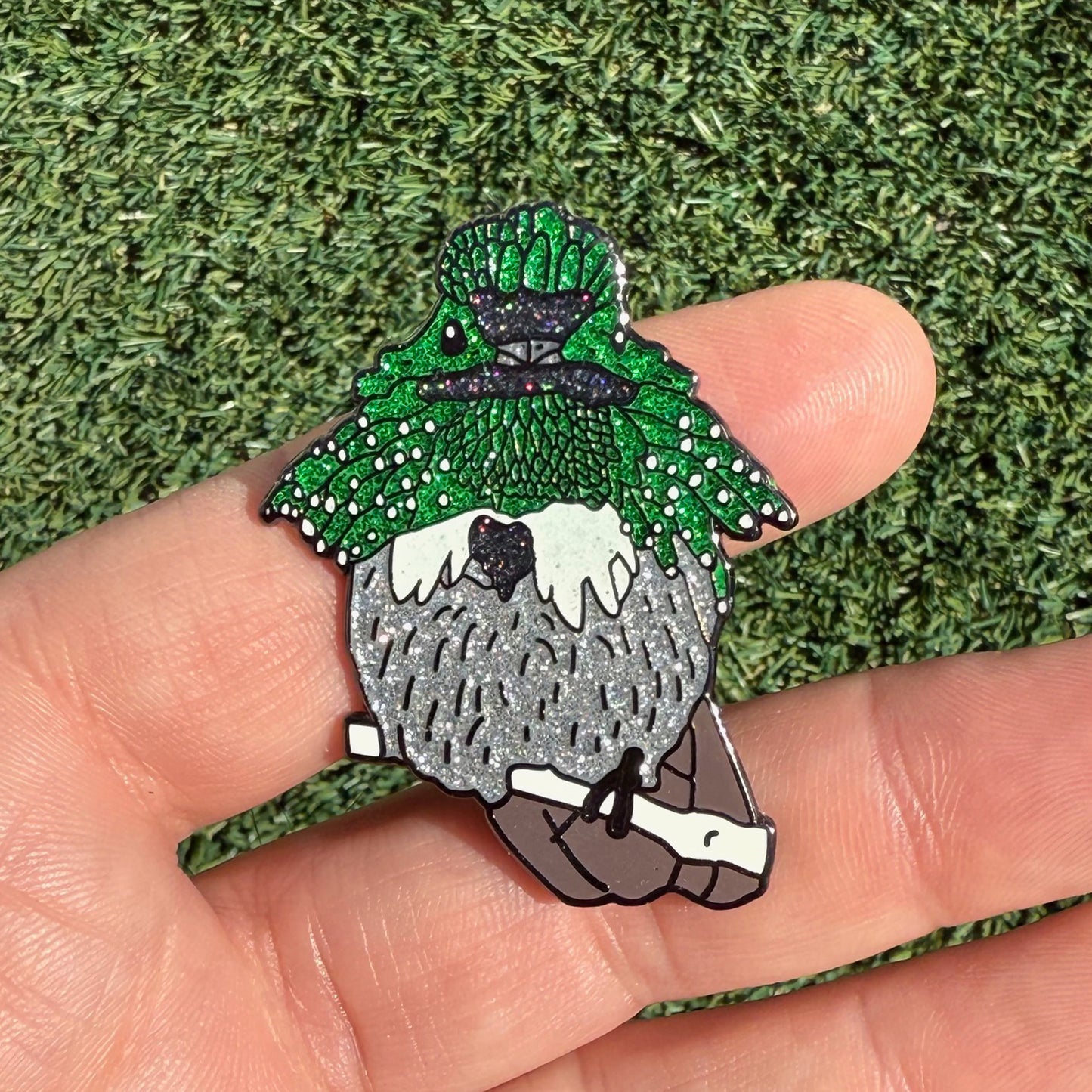 Festive Coquette pin in hand