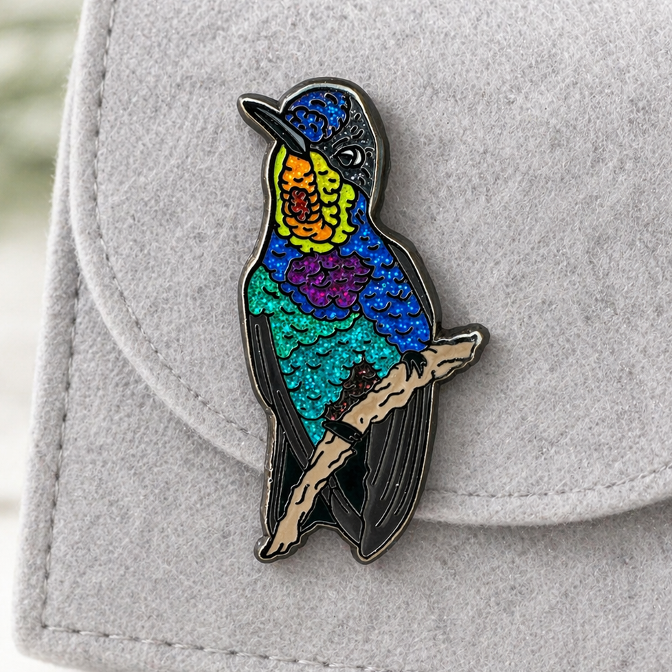 Fiery-throated Hummingbird glitter enamel pin by Anthony Lujan