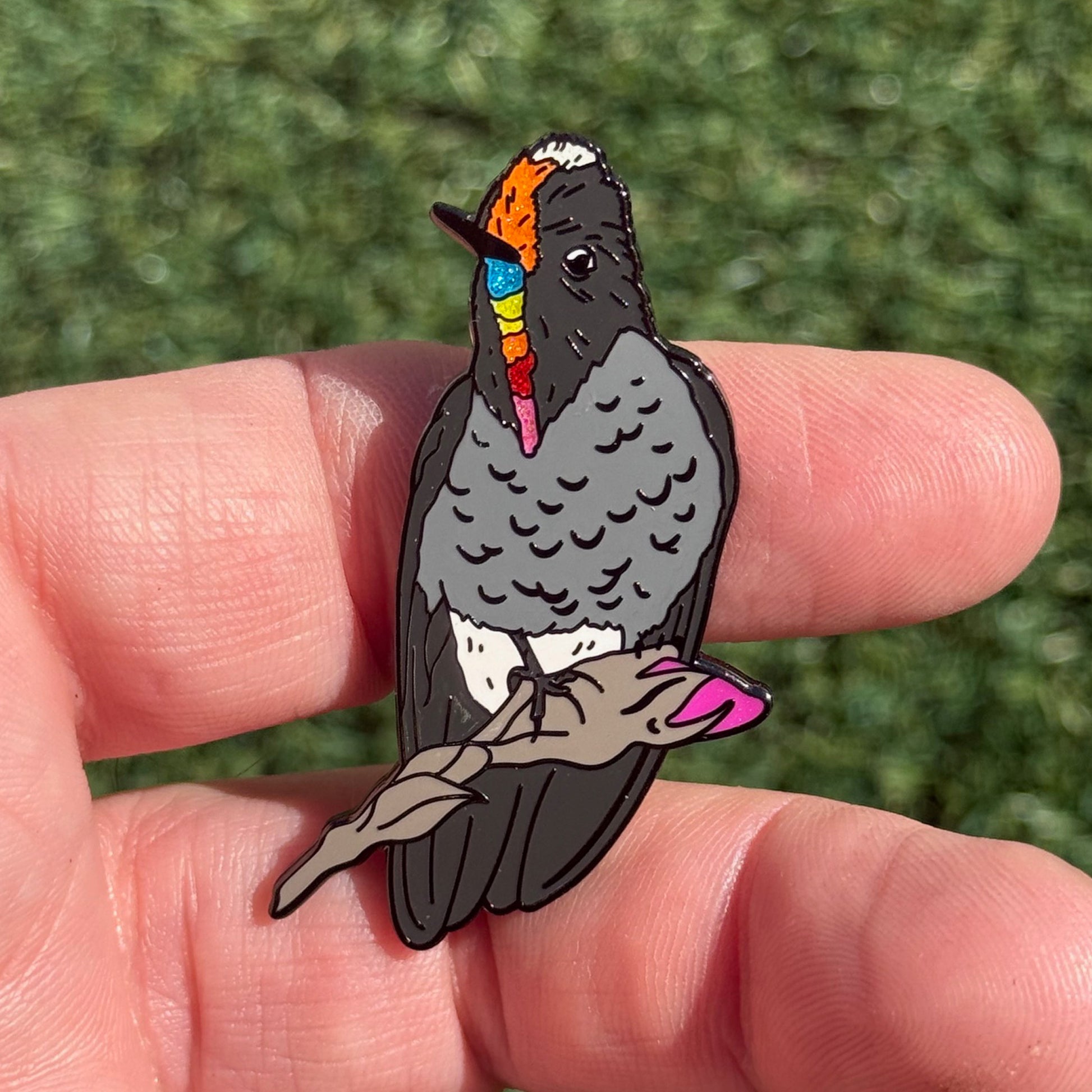 Rainbow-bearded Thornbill glitter pin in hand