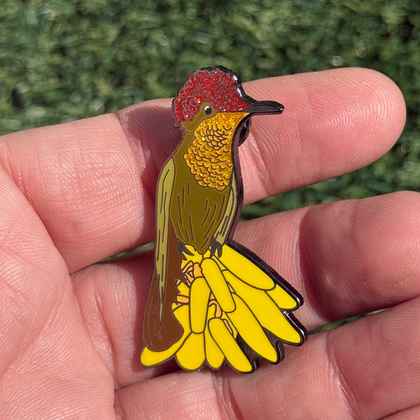 Ruby-topaz Hummingbird pin in hand