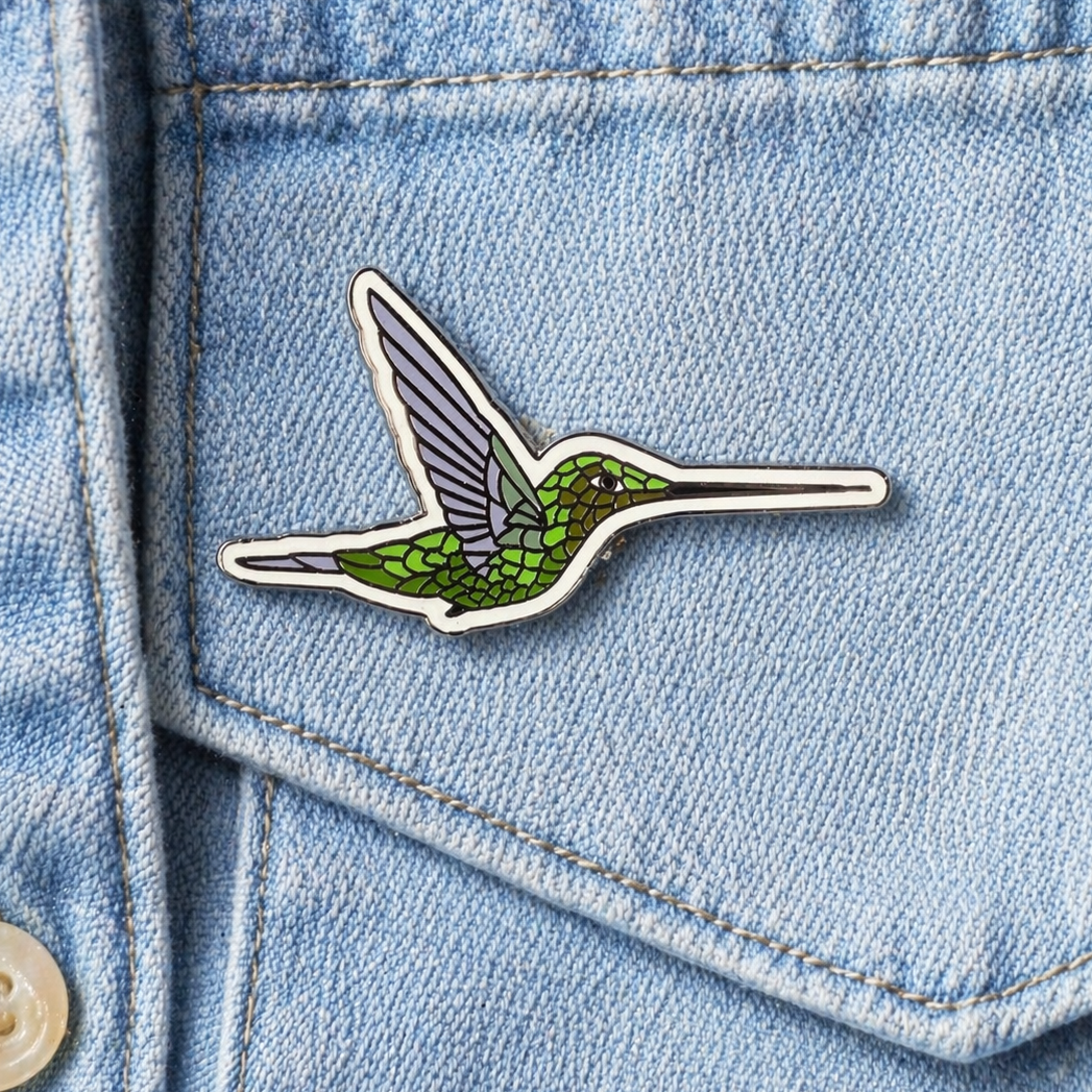 Sword-billed Hummingbird enamel pin by Anthony Lujan